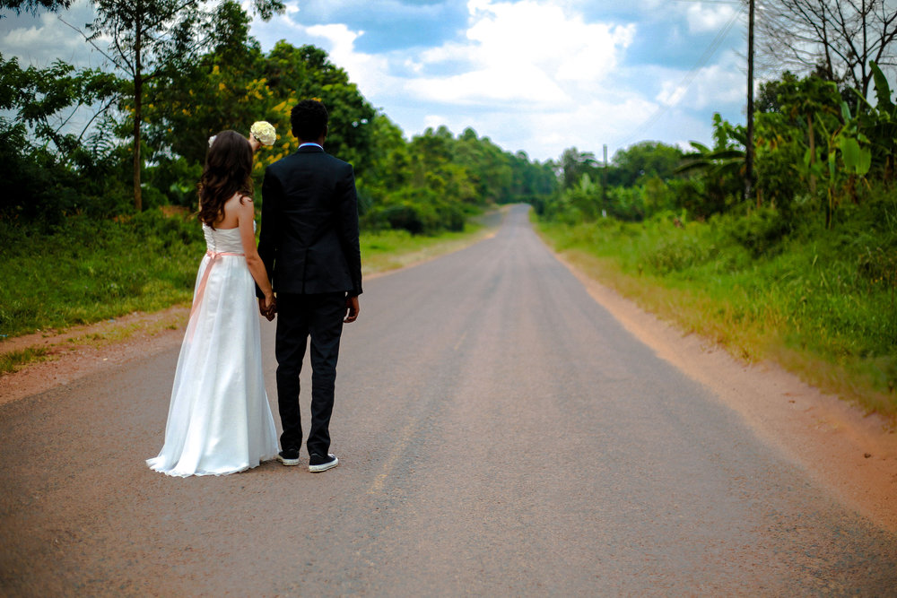 Newly married Couple holding each outer hands